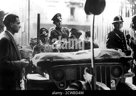 Liberation of Paris, 25 August 1944. A jeep of the French 12th Regiment of Cuirassiers (2nd Armoured Division) taking two German officers to surrender negotiations. Hitler had ordered that Paris be destroyed before it fell into Allied hands, but the military governor of the city, General Dietrich von Choltitz, declined to carry out the order and surrendered to the French on 25 August. The photographer is unknown. Stock Photo