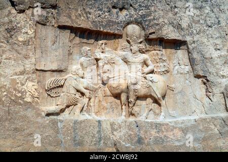 Photograph taken of the triumph relief of Shapur I, the most famous Sasanian rock relief at Naqsh-e Rostam. Stock Photo