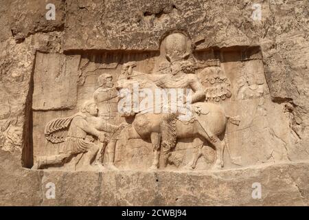 Photograph taken of the triumph relief of Shapur I, the most famous Sasanian rock relief at Naqsh-e Rostam. Stock Photo