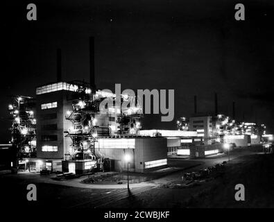 Photograph of Calder Hall, Cumberland, England, the first commercial-scale nuclear power station, at night. Stock Photo