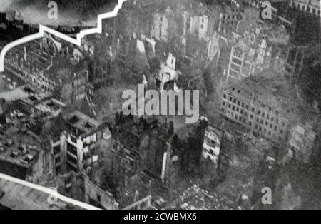 Black and White photograph of the bombing of London during the Battle of Britain in World War II (1939-1945); an aerial view of part of the city of London after a bombing raid. Stock Photo