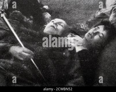 Black and white photograph of World War II (1939-1945) showing the remains of Italian dictator Benito Mussolini (1883-1945) and his mistress Clara Petacci (1912-1945) after their execution by firing squad. Stock Photo