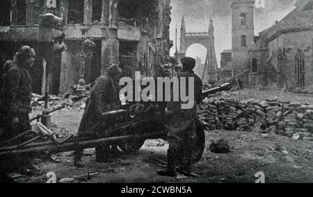 Black and white photograph of World War II (1939-1945) showing Soviet artillery in the streets of Budapest, February 1945. The photo was taken after a long battle in the streets. Stock Photo