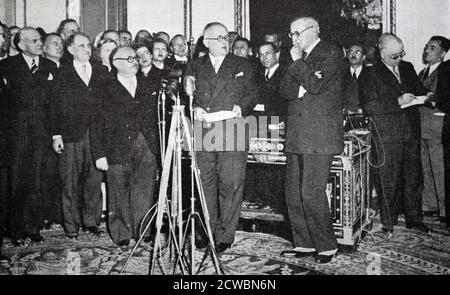 Black and white photograph of the election to the French presidency of Vincent Auriol (1884-1966), held on 16 January 1947. Auriol prepares to speak into a microphone in front of a group of men. Stock Photo