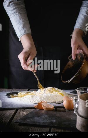 Female Hands Mixing Eggs In Bowl Isolated On White Stock Photo - Alamy