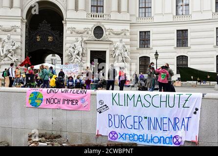 Vienna, Austria. 29th Sept 2020. The illegal occupation by Extinction Rebellion of Michaelerplatz was cleared by the police earlier this morning, the most climate activists want to return and continue to protest.  Image shows a banner that reads 'five to twelve and we're still celebrating'. Credit: Franz Perc/Alamy Live News Stock Photo