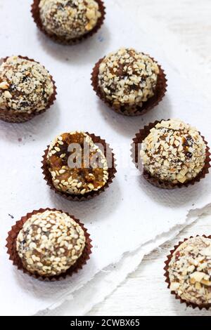 Homemade healthy candy made from dried fruits, honey and nuts. Rustic style. Stock Photo