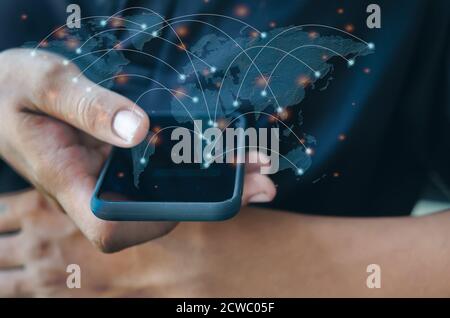 man hand holding a smartphone.Communicate with mobile phones and modern social networks around the world.Element of this image furnished by Nasa Stock Photo