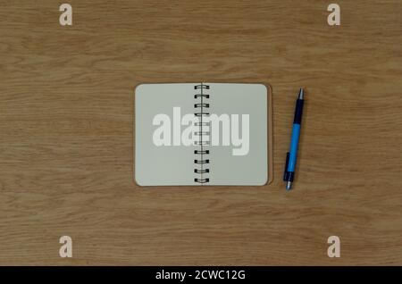 Top view notepad and pen on wood background Stock Photo