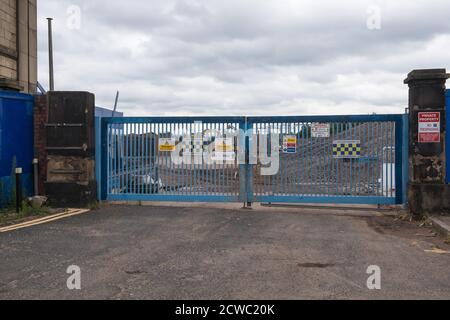 Locked blue steel gates at entrance to HS2 construction site at Curzon Street station in Digbeth, Birmingham, UK Stock Photo