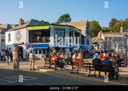 Padstow town, view in summer of people relaxing on The Strand inside Padstow harbour, Cornwall, south west England, UK Stock Photo
