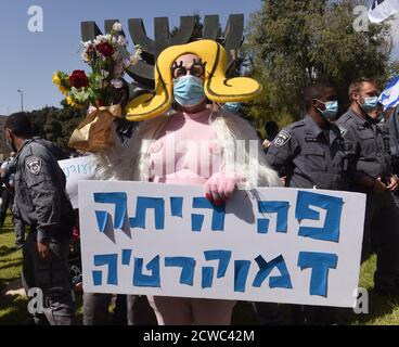 Jerusalem, Israel. 29th Sep, 2020. Israeli police surround a protester with a sign saying “There Was Democracy Here” at a protest during a nationwide COVID-19 lockdown, against Prime Minister Benjamin Netanyahu's proposed bill to restrict protests, outside the Knesset, the Parliament, on Tuesday in Jerusalem, September 29, 2020. The bill would forbid demonstrators from traveling more than one kilometer, 0.621 mile, from their homes, therefore stopping the weekly anti-Netanyahu protests outside his residence in Jerusalem. Photo by Debbie Hill/UPI Credit: UPI/Alamy Live News Stock Photo