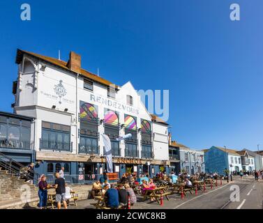 Outdoor dining at the Anchor Rendezvous pub in Weymouth, a seaside town holiday resort on the estuary of the River Wey, Dorset, south coast England Stock Photo