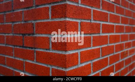 Corner of Bright Red Brick Building Stock Photo