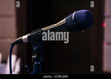 Black close up microphone in concert hall, audio system in studio Stock Photo
