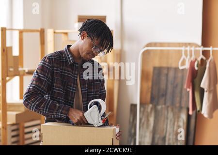 Carpenter with adhesive tape Stock Photo - Alamy