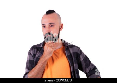 Young hispanic man immerse in deep thinking Stock Photo