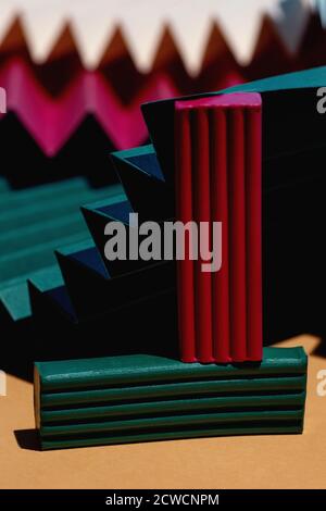 Modern multicolored composition of bars of clay and fans of cardboard. Stylish geometric concept. Stock Photo