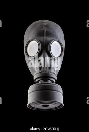 Black gas mask isolated on black background. Environment pollution. Stock Photo