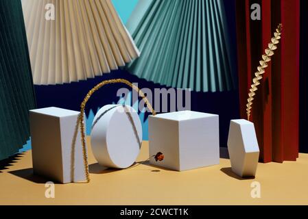 Composition of geometric shapes and colored fans made of cardboard. Concept. Stock Photo