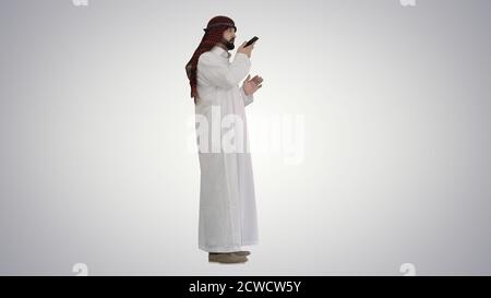 Arabian businessman recording voice message or using voice digit Stock Photo