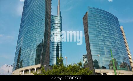 high rise modern Milanese skyscraper with mirrors in italy Stock Photo