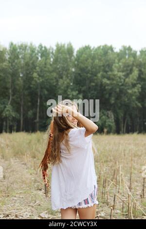 Hippie girl holding a dream catcher. Outdoor photography of people. Stock Photo