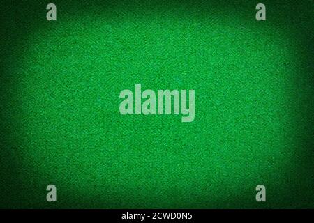 close up dark green snooker table felt soft rough textile material background texture. with shade vignette Stock Photo