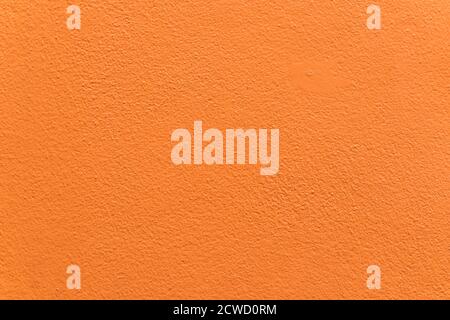 Empty orange cement wall background and texture. Beautiful clean orange concrete wall Advertising Backdrop. Stock Photo
