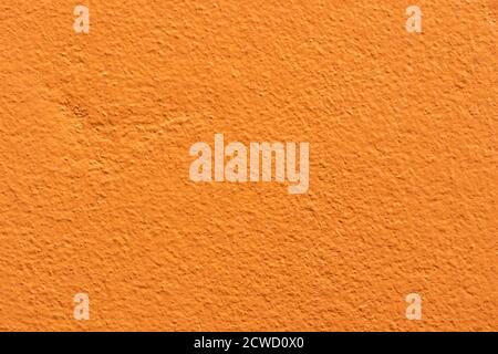 Empty orange cement wall background and texture. Beautiful clean orange concrete wall Advertising Backdrop. Stock Photo