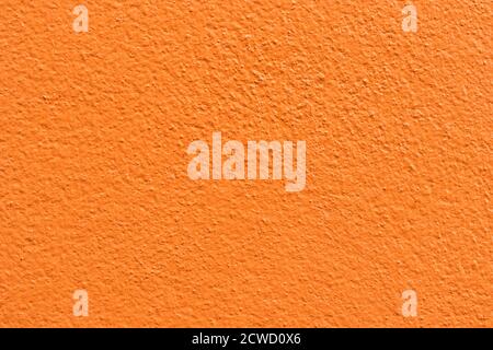 Empty orange cement wall background and texture. Beautiful clean orange concrete wall Advertising Backdrop. Stock Photo