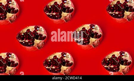 Pattern of red pomegranates in rows on red background, fruit lines backdrop, stripes garnet fruits art wallpaper Stock Photo