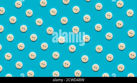 Top view of buttons in rows arranged on blue background Stock Photo