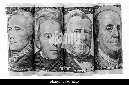 Three Presidents and Ben Franklin on US Banknotes Paper Money, side by side, federal reserve notes, rolled to show only portraits, Hamilton, Jackson, Stock Photo