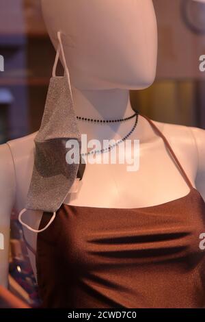 Funny showcase of a mannequin with facial mask against covid19 Stock Photo