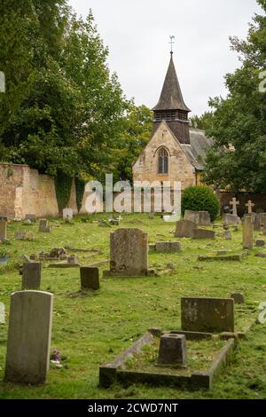 St Helens Church . Boultham Park Lincoln, Lincolnshire, woods, The Commonwealth War Graves Commission site, graveyard, small church, bell ringing. Stock Photo