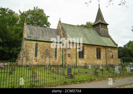 St Helens Church . Boultham Park Lincoln, Lincolnshire, woods, The Commonwealth War Graves Commission site, graveyard, small church, bell ringing. Stock Photo