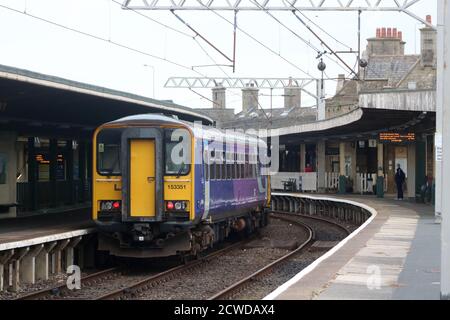 Single car class 153 diesel train with palindromic number 153351 in unbranded Northern livery, Carnforth railway station, Monday 28th September 2020. Stock Photo