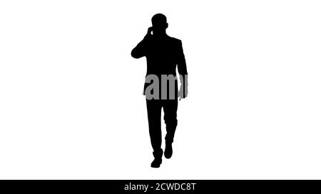Businessman walking and making a call, Alpha Channel Stock Photo