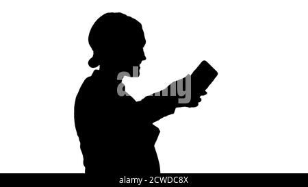 Silhouette Smiling Businesswoman taking selfie on her phone. Stock Photo