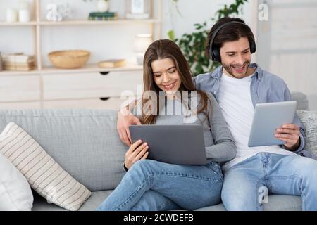 Relaxed man and woman spending weekend at home Stock Photo