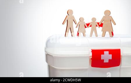 Family medicine. Family with children on the background of the first-aid kit. Stock Photo
