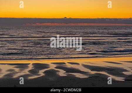 Evening Colors on the Sand and Sky at Cape Lookout State Park in Oregon Stock Photo