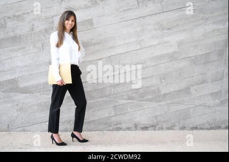 Portrait of a successful business woman holding documents. High quality photo Stock Photo