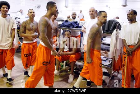 Inmates walk around a gymnasium where they are housed due to overcrowding at the California Institution for Men state prison in Chino, California, June 3, 2011. The Supreme Court has ordered California to release more than 30,000 inmates over the next two years or take other steps to ease overcrowding in its prisons to prevent 'needless suffering and death.' California's 33 adult prisons were designed to hold about 80,000 inmates and now have about 145,000. The United States has more than 2 million people in state and local prisons. It has long had the highest incarceration rate in the world. 