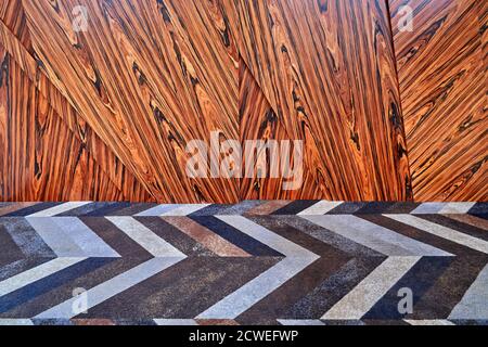 3D wood wall panels with multicolored carpet. Wood veneer wall panels elements are covered with dust. Rosewood reconstituted veneer. Furniture manufac Stock Photo