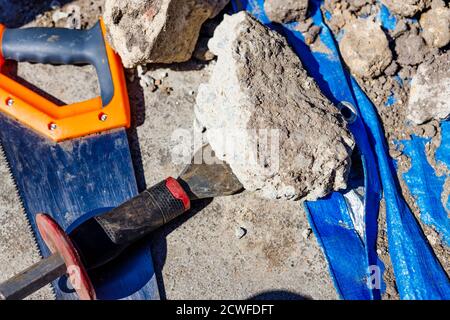 pile of soil and debris in backyard with building tools during construction and landscaping work Stock Photo