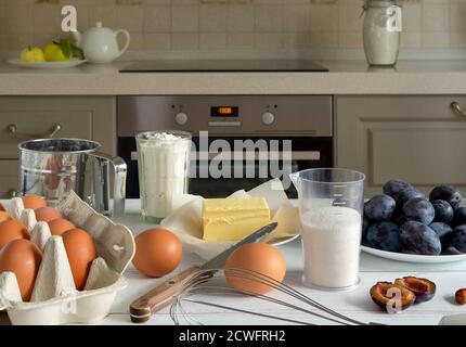 Products prepared for baking seasonal plums. Stock Photo