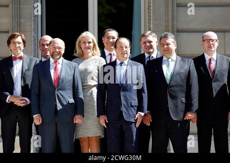 French President Francois Hollande (C) poses with, from the (L-R), Belgium Prime Minister Elio Di Rupo, Dutch Labour Party (PvdA) leader Diederik Samsom, EU Parliament President Martin Schulz, Denmark Prime Minister Helle Thorning-Schmidt, Romania Prime Minister Victor Viorel Ponta, French President Francois Hollande, Slovakia Prime Minister Robert Fico, German Economy Minister Sigmar Gabriel, and Czech Republic Prime Minister Bohuslav Sobotka for photographers at the Hotel de Marigny at an informal meeting of European Social-Democrat leaders in Paris June 21, 2014. The meeting is to seek a co