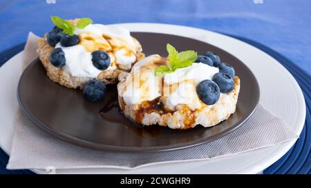Fresh healthy mini sandwiches with cream cheese and blueberries Stock Photo